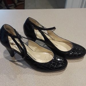 Black patten leather pumps